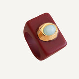 Anillo mujer burdeos con turquesa