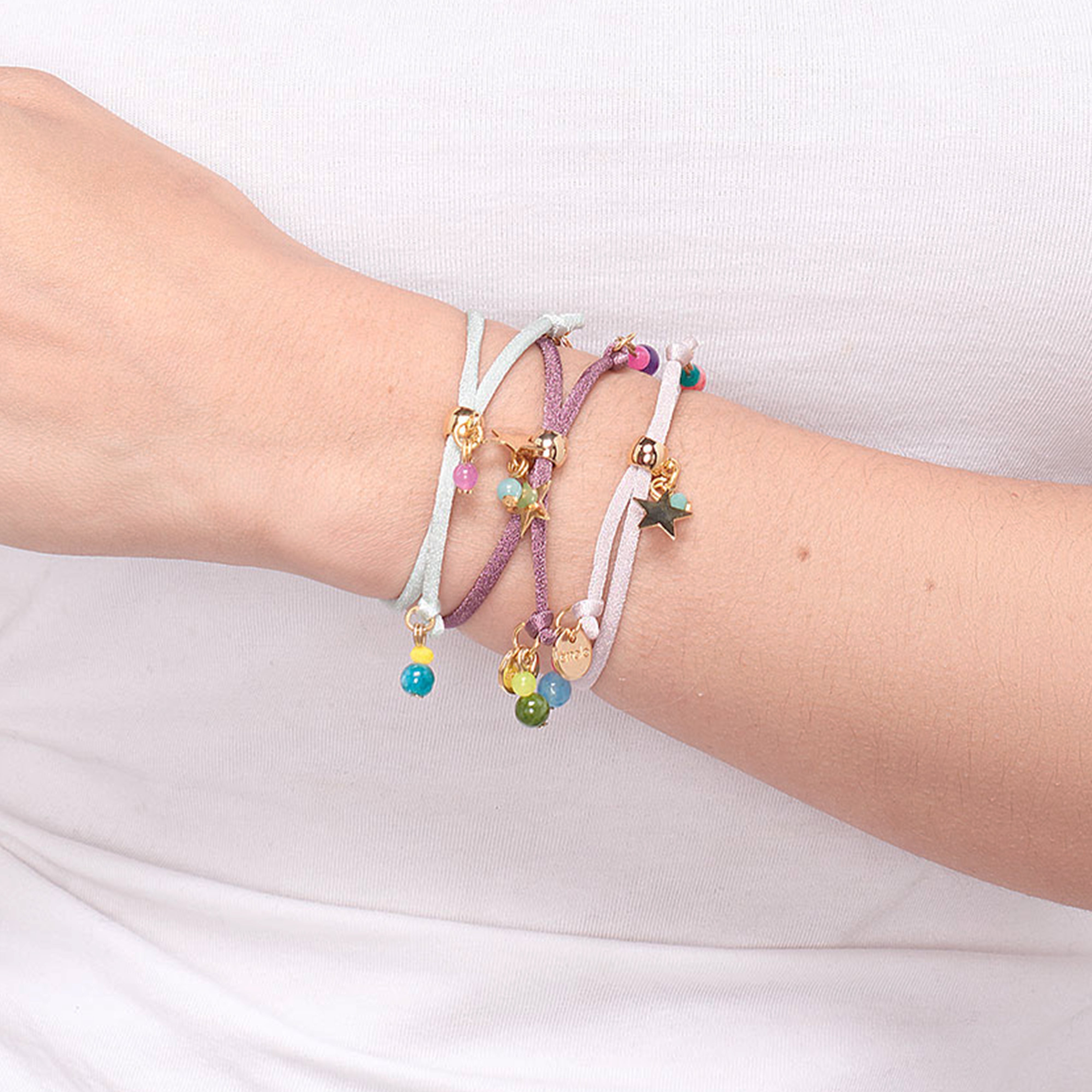 Miz Estrellita bracelet on the wrist, close-up of the golden star — Émolo