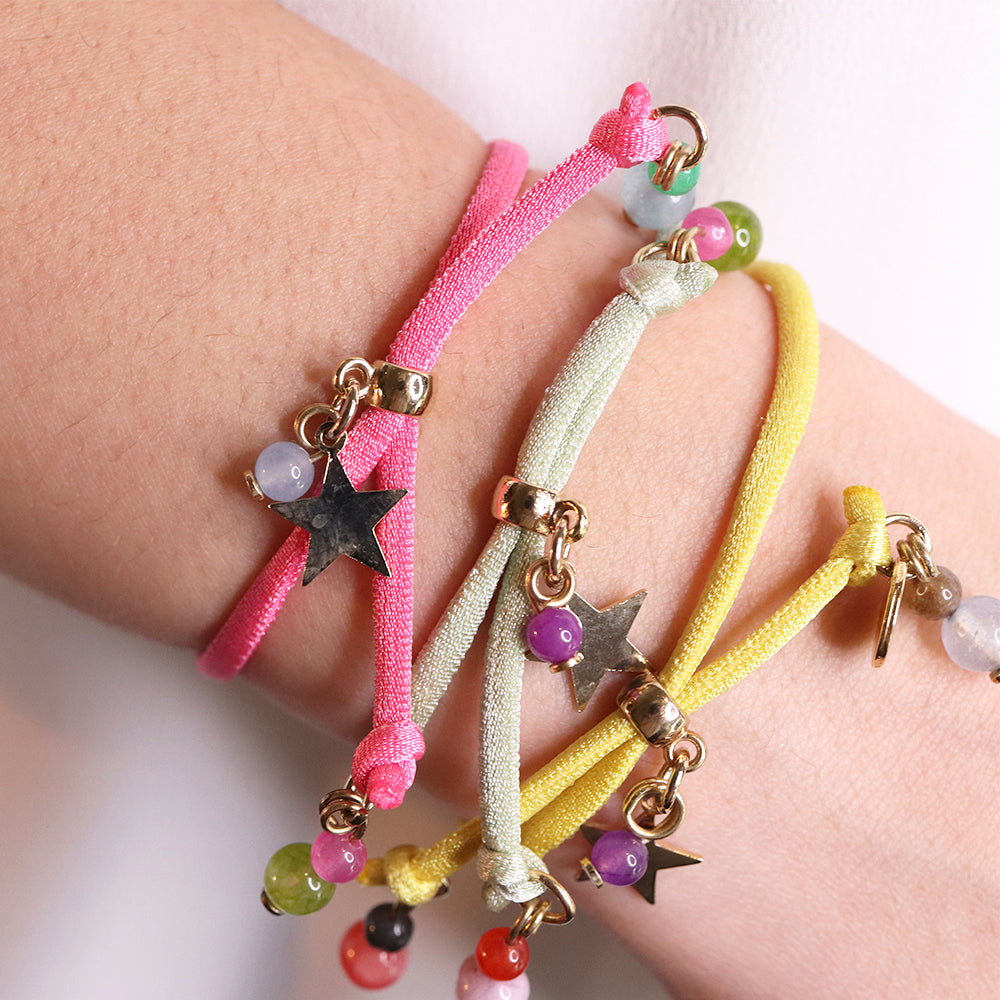 Miz Estrellita bracelet with golden star, worn on a model — Émolo