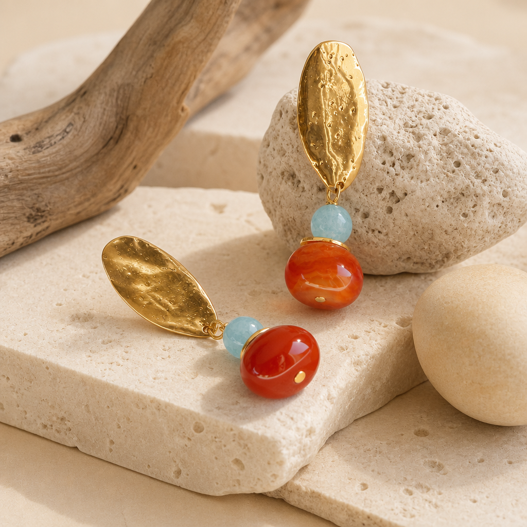 Close-up of the BAVARO earrings in blue and honey, natural stones and hammered golden details