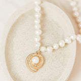 collar de perlas con colgante