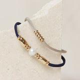 Pulseras elásticas con piezas doradas