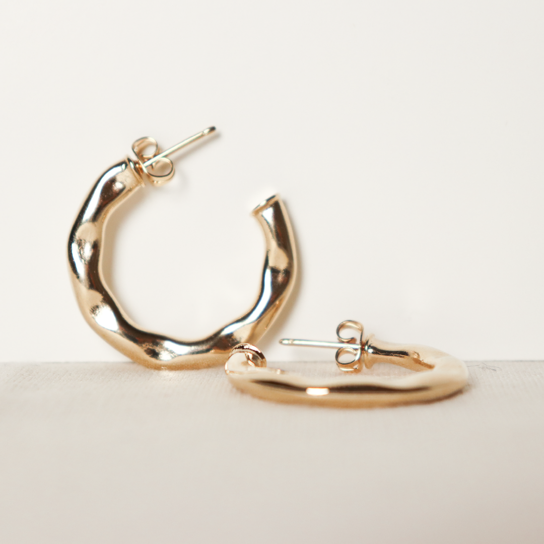 Gold-tone stud earrings with embossed design