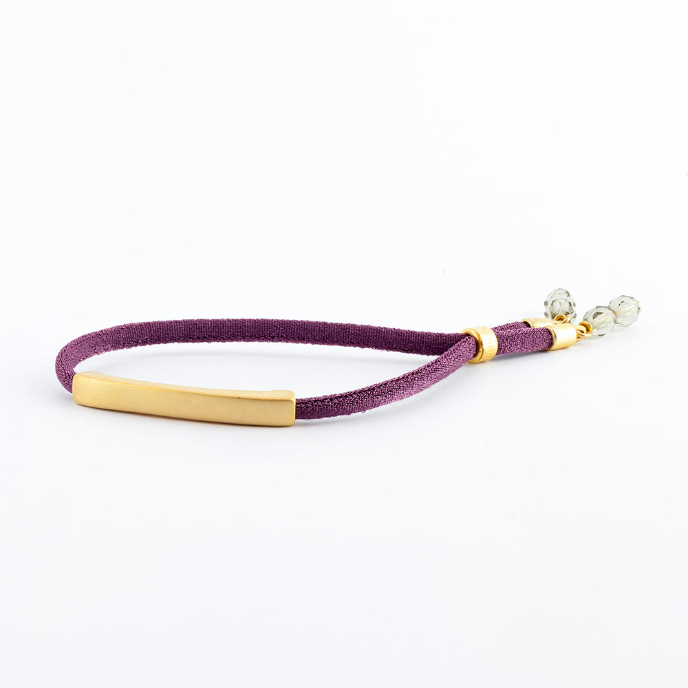Pulsera color berenjena ajustable con pieza dorada para mujer