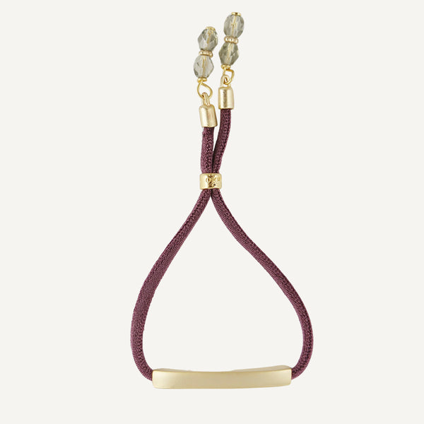 Pulsera para mujer elástica color berenjena con pieza dorada