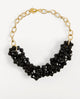 Collar Odri Sienna negro de Emolo con varias hileras de cuentas negras facetadas y cadena de eslabones dorados