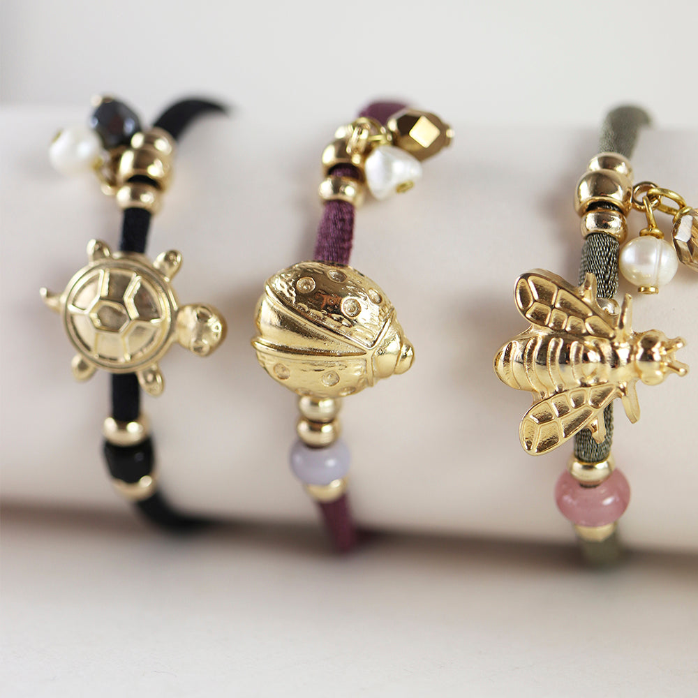 Pulseras ajustables con piezas doradas con formas de animales