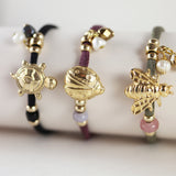 Pulseras ajustables con piezas doradas con formas de animales