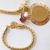 Collar para mujer cadena tipo snake con pieza circular dorada y piedra natural