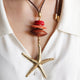 Macao Monsul star necklace in brown, star pendant and wooden beads on a cord — Émolo