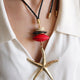 Macao Monsul star necklace in fuchsia, star pendant and wooden beads on a cord — Émolo