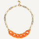 Fluorescent orange necklace with gold chain.