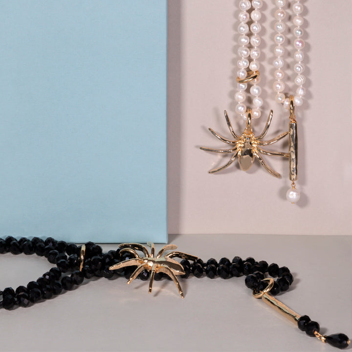 pearl and crystal necklace and brooch